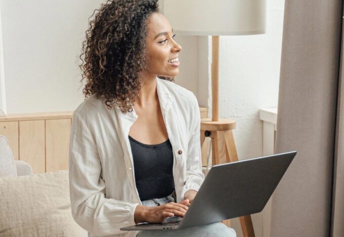 A woman researching mortgage rates on her laptop.