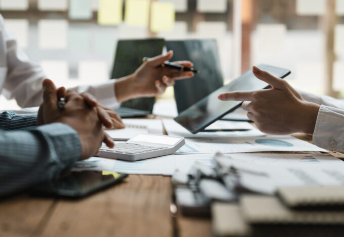 Couple learns what a loan officer is during meeting with mortgage lender.